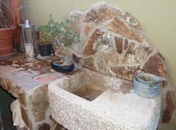 Antique reclaimed farmhouse trough sink hand carved back in the 16th century refurbished to accomodate any modern setting and application from a powder room to a BBQ preparation sink. Wonderfully carved stone legs.